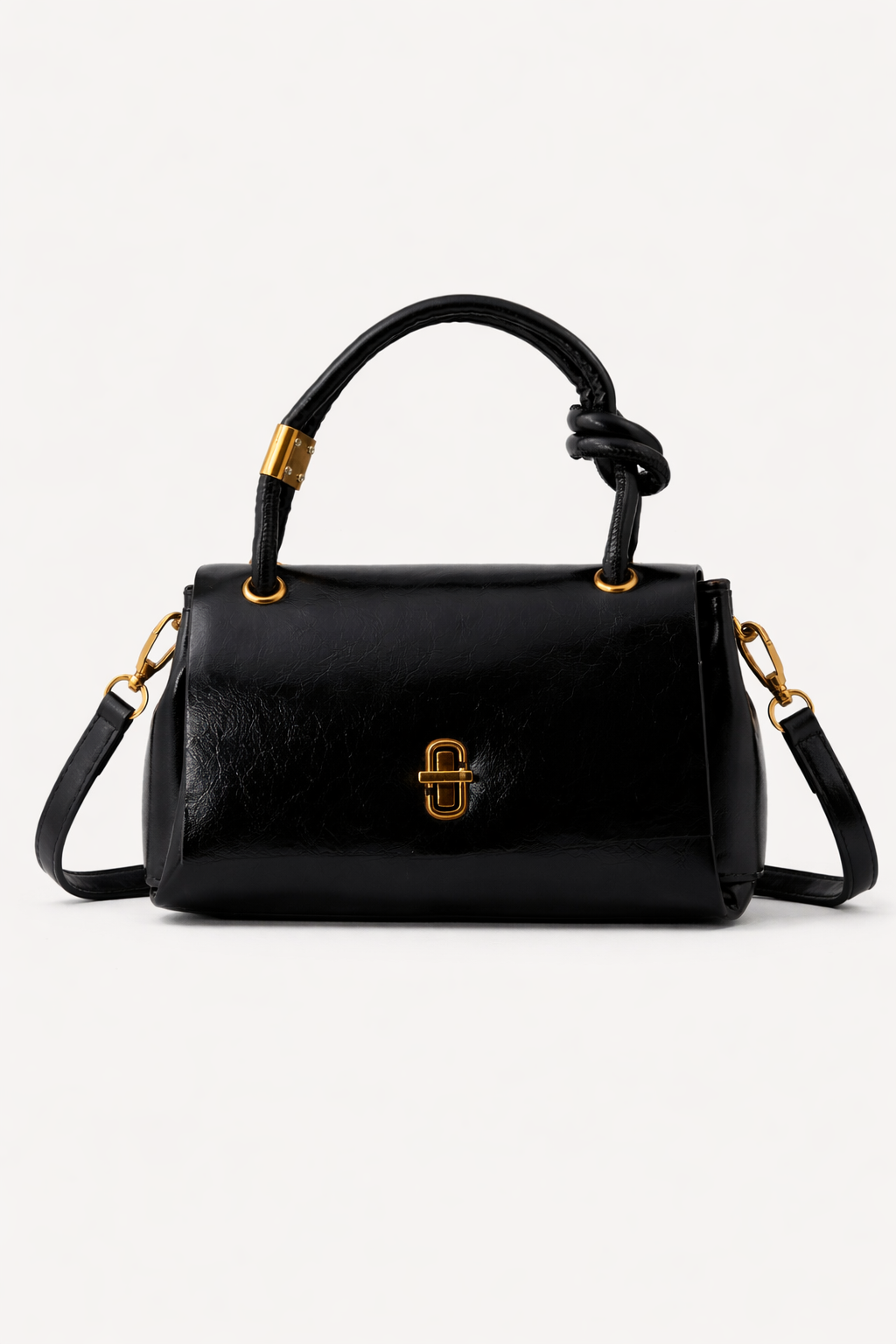 Black handbag with gold accents on a white background