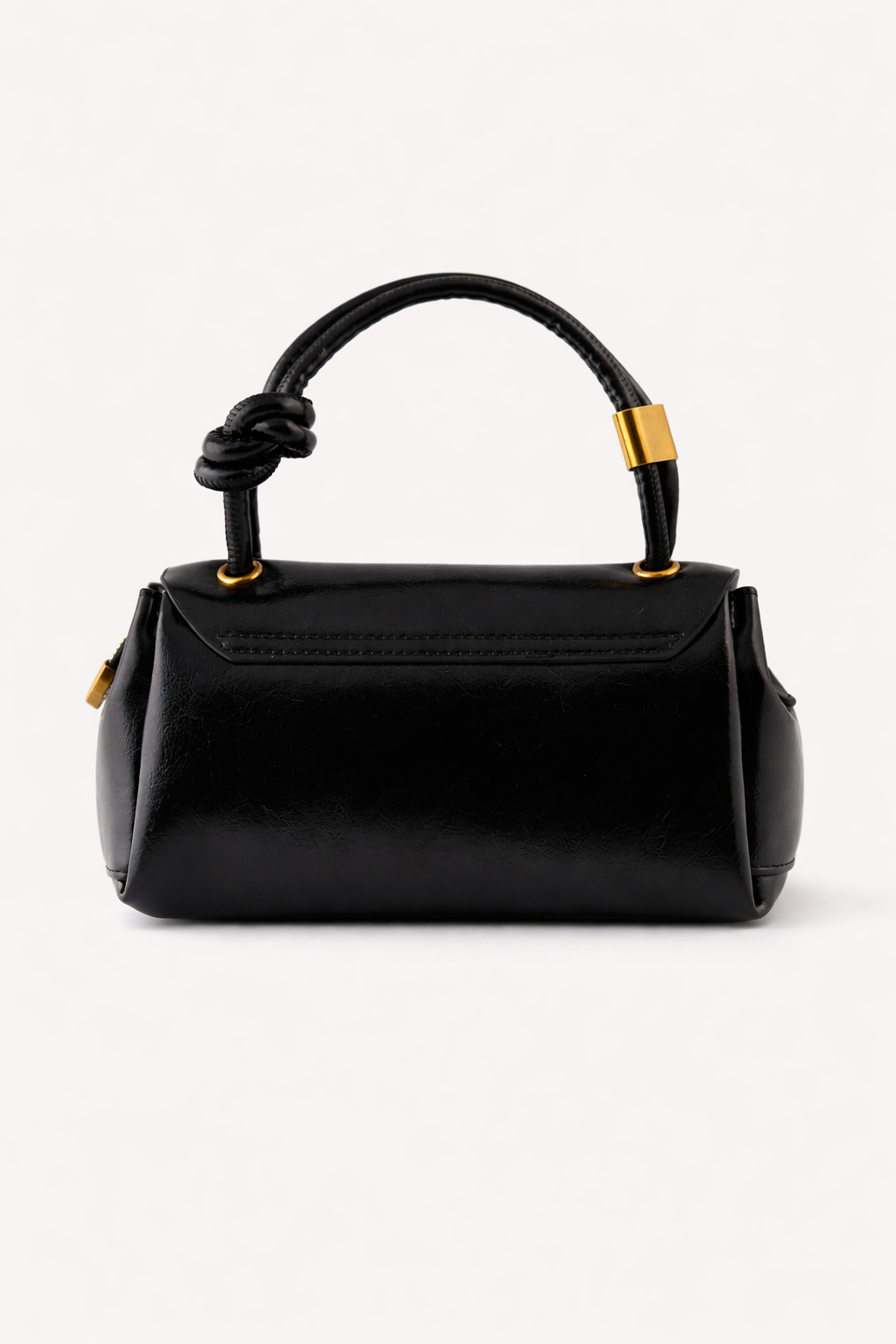 Black handbag with a knotted handle on a white background