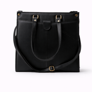 Black leather tote bag with gold hardware on a white background